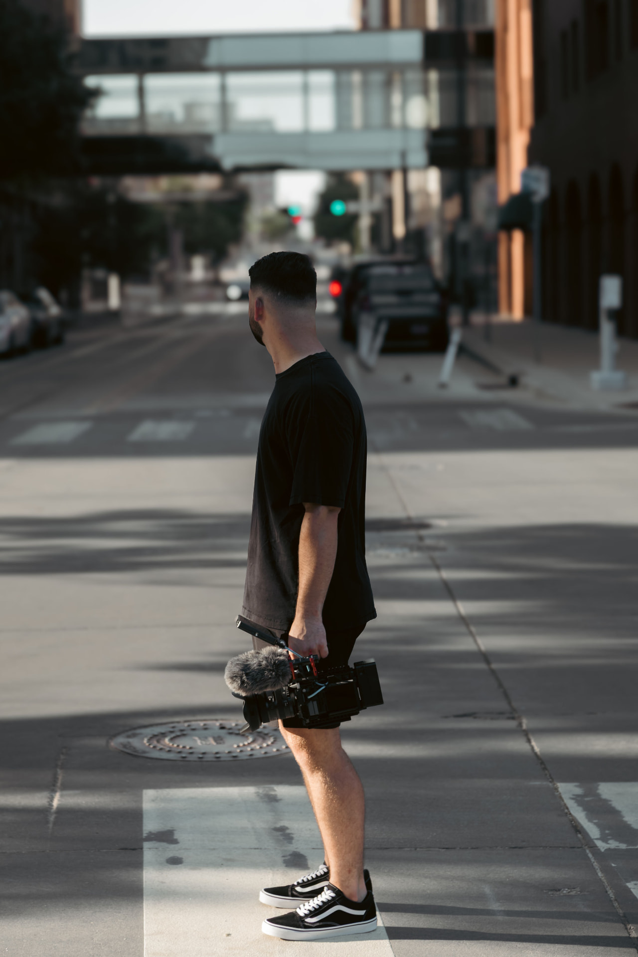 Cody Smith filming on a rooftop in downtown Oklahoma City